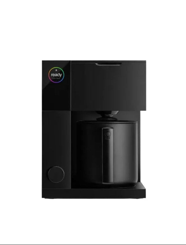 Black coffee maker on a white background wit Fellow Aiden brand